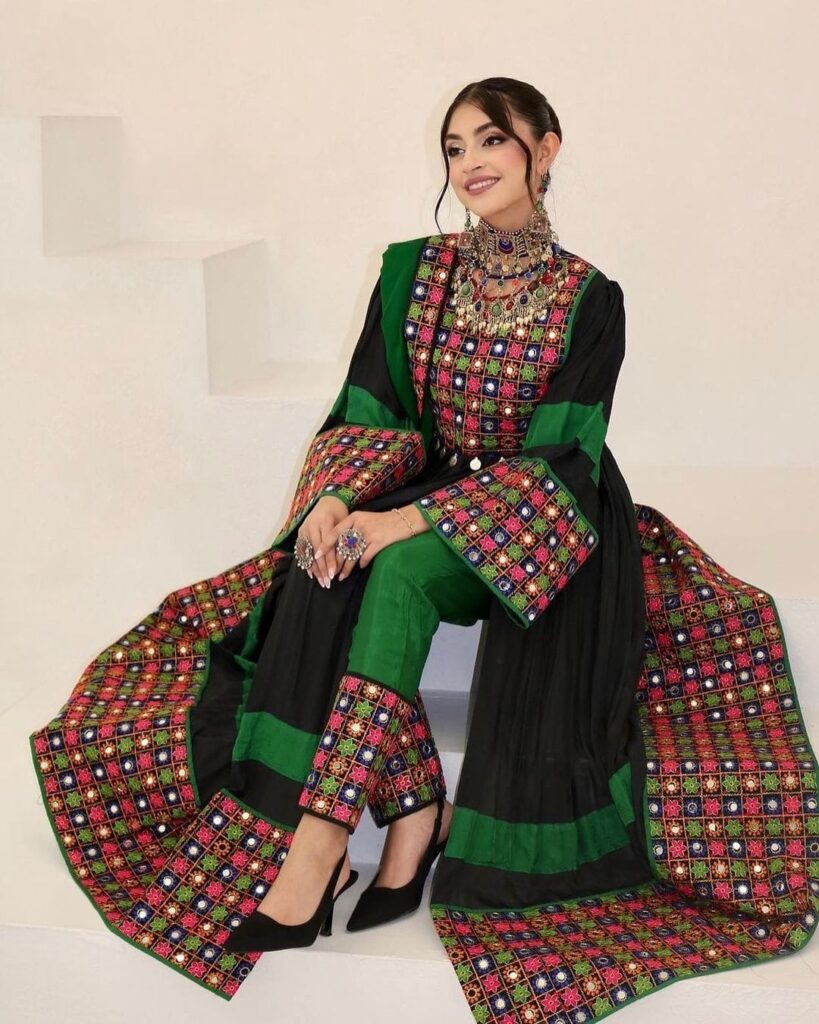 Modern Afghani black dress by ZGCzeenat with elegant, traditional Afghan design and intricate detailing, perfect for cultural events and formal occasions.