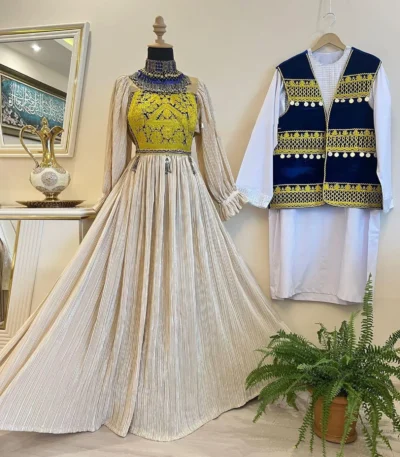 Matching Afghani couple dress set by ZGCzeenat with traditional Afghan embroidery and vibrant patterns, perfect for cultural events and celebrations.