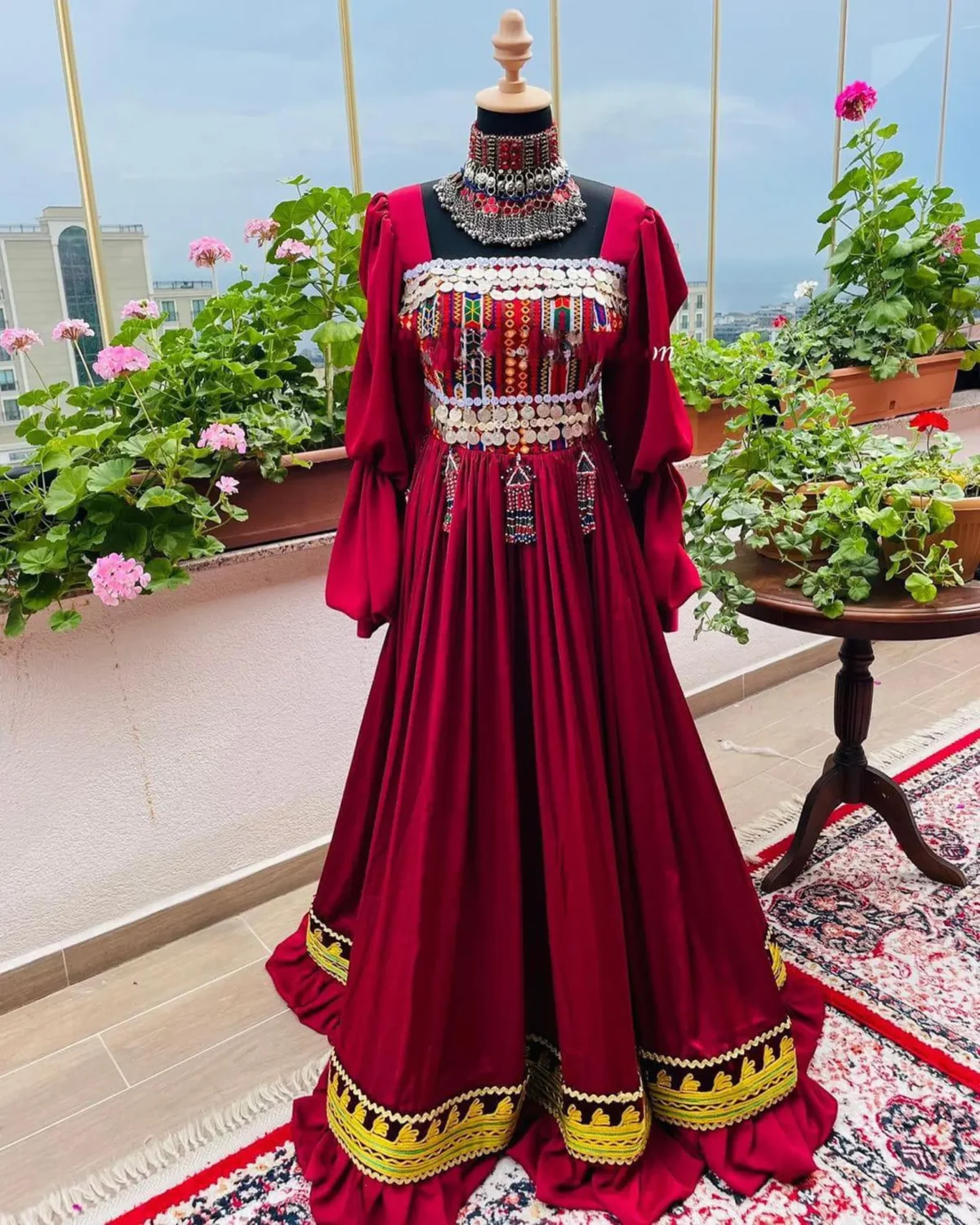 Stunning Afghani red dress by ZGCzeenat with traditional embroidery, perfect for cultural events and special occasions, showcasing Afghan craftsmanship.